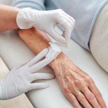 Leukomed skin sensitive by Leukoplast close-up view of dressing application